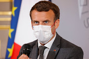 Macron says intellectual property rights shouldn't get in the way of access to vaccines. 