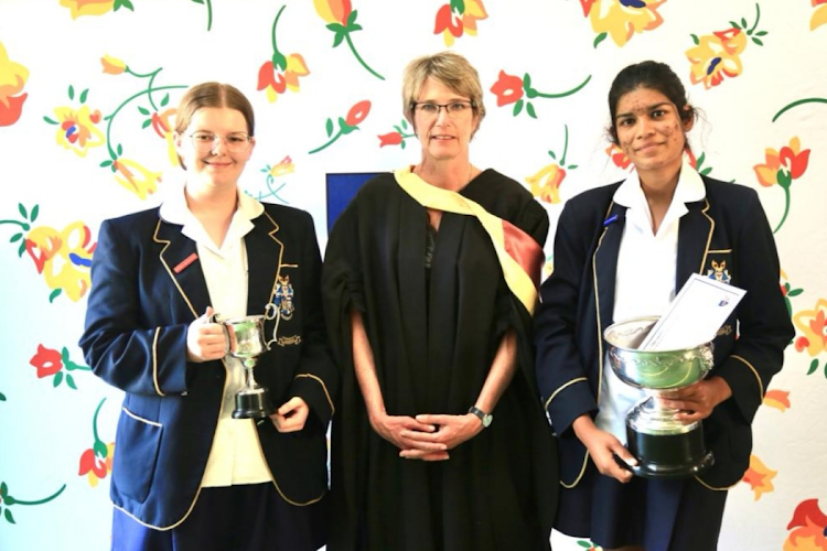 The Wykeham Collegiate principal Sue Tasker with matric top achievers and Maeve Miranda, left, and Gemma Bernhard.