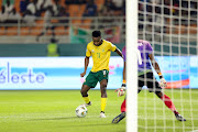 Themba Zwane of South Africa shoots and scores a second goal past Lloyd Kazapua of Namibia during the 2023 Africa Cup of Nations match at Amadou Gon Coulibaly Stadium in Korhogo on Sunday.