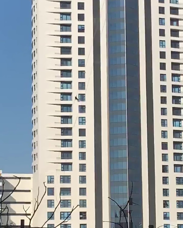 A window cleaner caught the attention of those on the ground as he battled to grab onto the Pearls of Umhlanga building on Wednesday