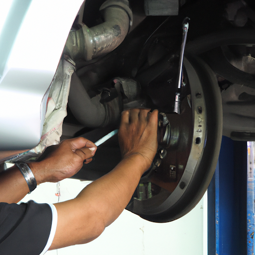 mechanics working on car