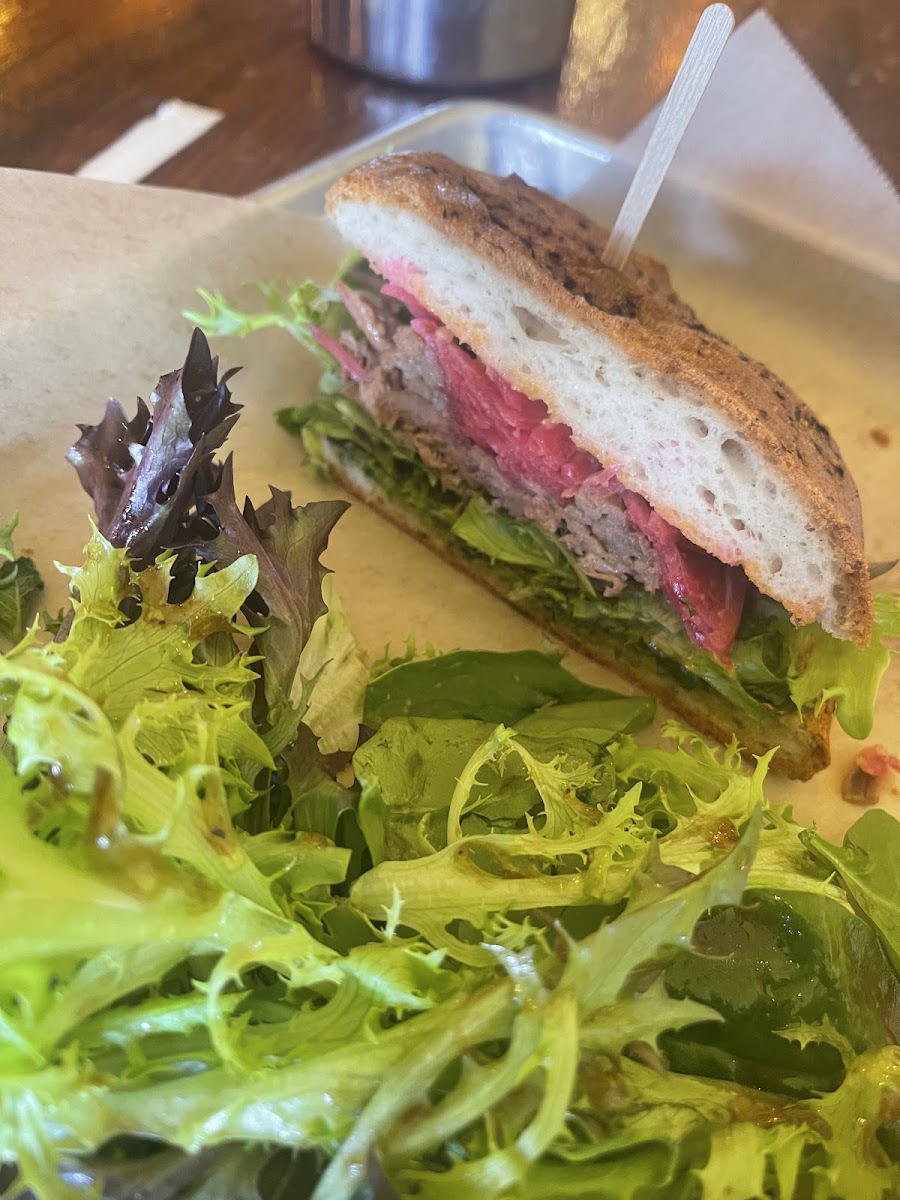 Brisket sandwich on gluten free garlic ciabatta