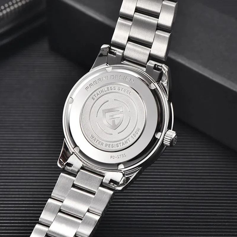 Montre quartz homme simple, étanche, cadran ciel étoilé, bracelet acier, trotteuse fluide pour un look élégant et fonctionnel.