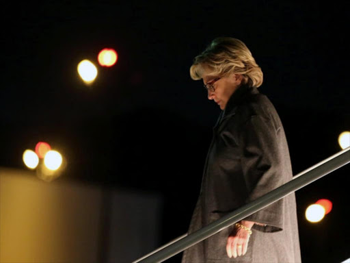 US Democratic presidential nominee Hillary Clinton gets off her plane in White Plains, New York, US October 11, 2016. Picture taken October 11, 2016. /REUTERS