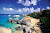 Visitors walk the beach during a shore excursion at The Baths on Virgin Gorda in the British Virgin Islands.