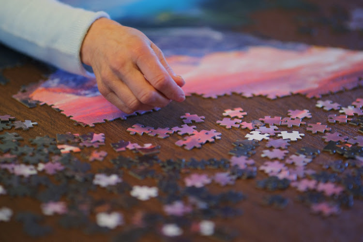 Wendy Nelson does a puzzle at her home in Foxborough, Massachusetts, US, March 21, 2023.