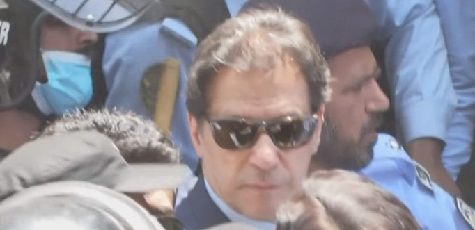 Crowds swarm Imran Khan as he arrives at court on Friday