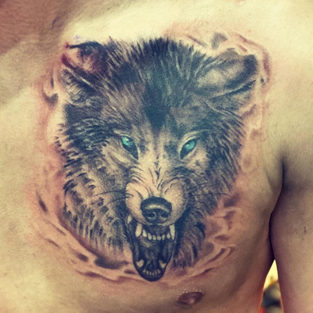 Green-eyed Wolf Head Tattoo On chest