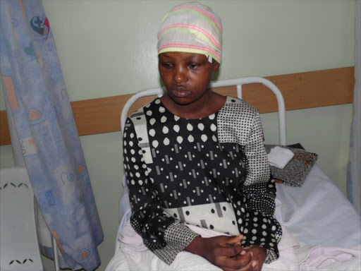 LOST BABY: Justa Kawira at Lang’ata Hospital on February 3. She was allegedly battered by husband John Wachira in Lang’ata on February 1.