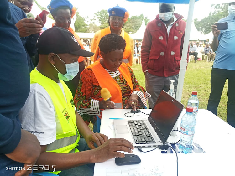 Residents queue during a huduma mashinani outreach plan in Kakamega.