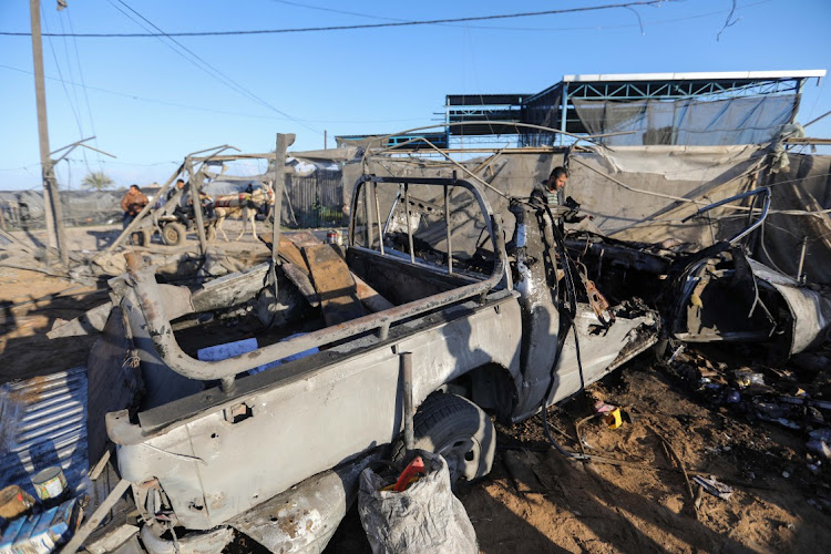 People inspect damage and recover items from their homes following Israeli air strikes on March 15 2024 in Rafah, Gaza. Picture: Ahmad Hasaballah/Getty Images