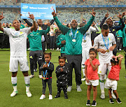 Andile Jali, Downs coach Pitso Mosimane  and Gaston Sirino celebrate  the Cup victory. /Anesh Debiky/Gallo Images