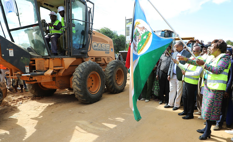 Kitui Governor Charity Ngilu, Transport Principal Secretary Mwangi Maringa (C) and the Kenya Highway Authority director general Kung'u Ndung'u during the launch of the upgrading of Wikililye-Wote Road on Friday