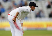 A file photo of England captain Joe Root shining the ball during a Test match against Pakistan at Edgbaston in Birmingham. Root says the ban on the use of saliva can actually help improve bowlers' skill levels.   