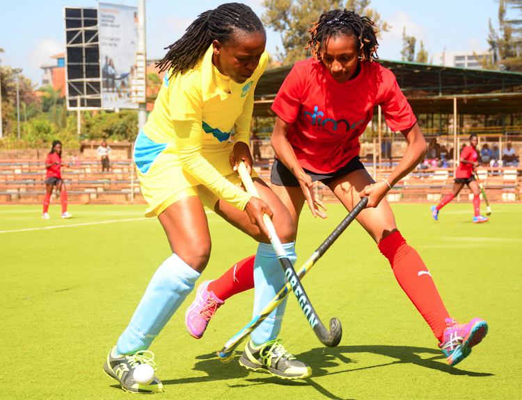 Telkom's Terry Juma Tracy karanja (L) challenges Olympia Chepchumba of Amira Sailors during their league match at City Park on March 10