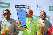 Mens winners (L-R) Warinyane Lebopo, Lungile Gongqa and Teboho Sello during the 2017 Old Mutual Two Oceans Marathon 56km awards ceremony on April 15, 2017 in Cape Town, South Africa. (Photo by Roger Sedres/Gallo Images)