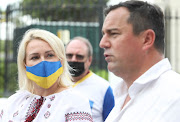 DA leader John Steenhuisen and Ukrainian ambassador in SA Liubov Abravitova address the media outside parliament.