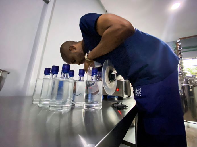 Chibueze Akukwe, co-founder of Pedro's gin distillery is seen fixing a tool during a production in Lagos, Nigeria on April 5 2021.