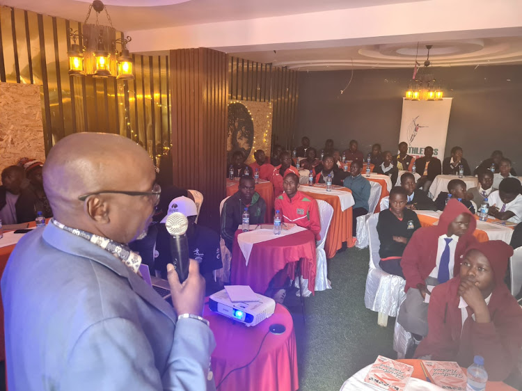 AK Youth Committee chairman Barnabas Korir while addressing junior runners during the anti-doping seminar in Kitale, Trans Nzoia county.