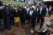 President Cyril Ramaphosa inspects the damage to property caused by torrential rains in New Germany. 