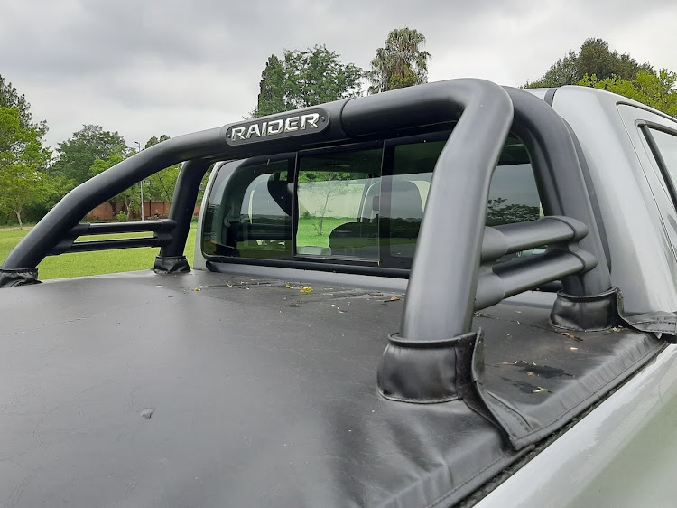 Tonneau cover and styling bar over load-bin are standard.