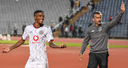 Orlando Pirates midfielder and hat-trick hero Monnapule Saleng (L) and coach Jose Riveiro celebrate the 4-1 DStv Premiership win over Swallows at Dobsonville Stadium on March 03, 2023 in Johannesburg, South Africa.