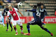 Toriq Losper of Ajax Cape Town attempts to take on Edwin Gyimah of Bidvest Wits during the Absa Premiership 2017/18 game between Ajax Cape Town and Bidvest Wits at Athlone Stadium, Cape Town on 11 April 2018.