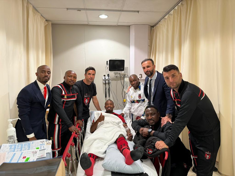 TS Galaxy staff surround Bernard Parker in hospital where he was admitted following his injury