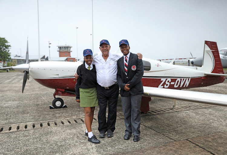 Aspiring pilots Sindiswa Mnikathi and Ndumiso Makhaye and mentor Ken Phillips of Lincoln Aviation.