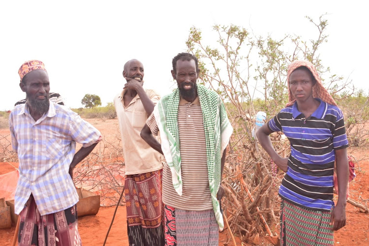 Residents of Elnur/Tulatula ward at the scene where the the bomb that injured three people last Monday was collected.