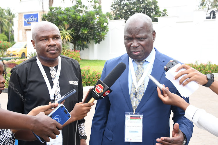 Labour Principal Secretary Shadrack Mwadime and the African Regional Labour Administration Center chairman, July Moyo during a press conference in Mombasa.