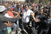 IDOLISED:  Julius Malema speaks to mine  workers  at Gold Fields   mine in Carletonville in the West Rand. PHOTO: ANTONIO MUCHAVE