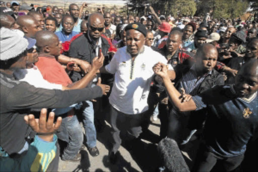 IDOLISED: Julius Malema speaks to mine workers at Gold Fields mine in Carletonville in the West Rand. PHOTO: ANTONIO MUCHAVE