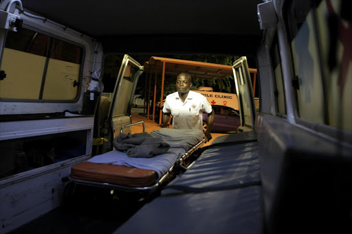 June 27, 2016. BETTER CONDITIONS: Isaiah Matidze , a paramedic at Masisi emergency medical services unit in Limpopo, loads an ambulance stretcher after cleaning the vehicle in a proper wahs bay. Photo Sandile Ndlovu. © Sowetan