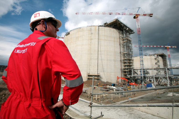 An employee of Sakhalin Energy stands at the Sakhalin-2 project's liquefaction gas plant in Prigorodnoye, about 70 km south of Yuzhno-Sakhalinsk on October 13, 2006. File Picture: REUTERS/Sergei Karpukhin