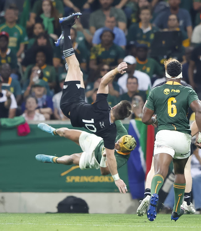 All Blacks flyhalf Beauden Barrett falls to the ground after colliding with Springbok wing Kurt-Lee Arendse during the Rugby Championship match at Mbombela Stadium. Barrett has been cleared to play at Ellis Park but will start from the bench.