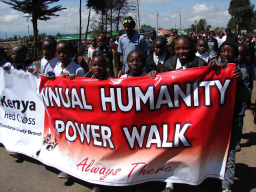 Pupils and students participating in Red Cross annual humanity walk on Saturday. /NDICHU WAINAINA