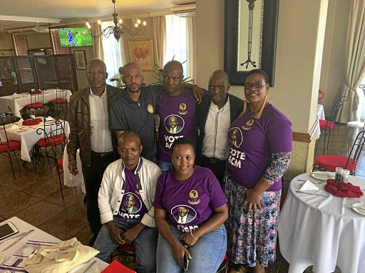 African Content Movement leader, Hlaudi Motsoeneng, second right, standing, with new recruits from the collapsed Mazibuye African Congress.