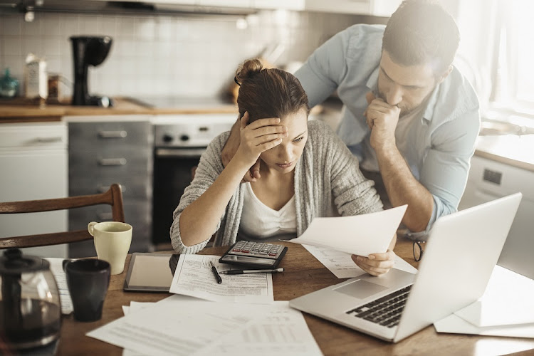 A generic image of a couple going through their finances.