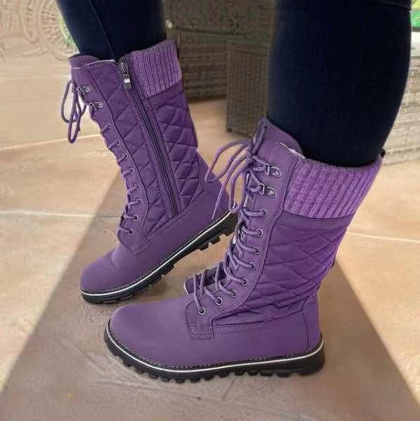 Dames Martin Boots met middelhoge schacht, platte hak, ronde neus en ritssluiting. Comfortabele stijl voor dagelijks gebruik.