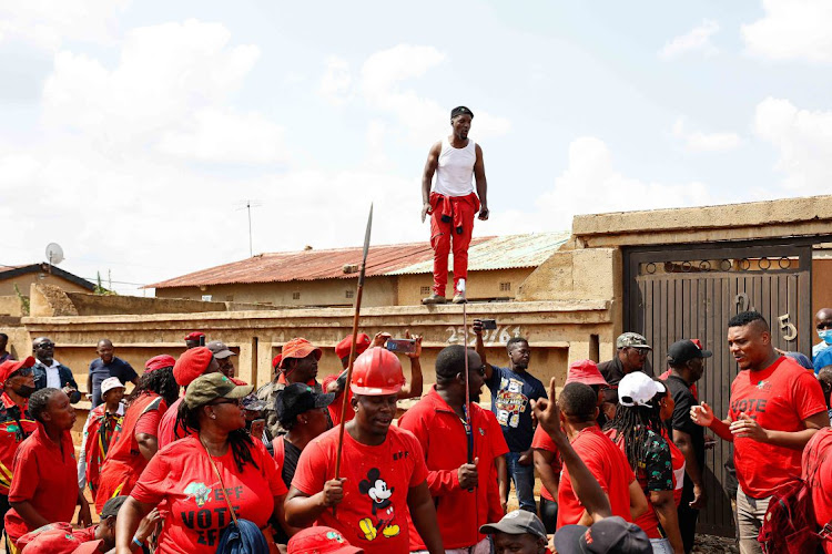 EFF supporters outside the home of Victor Ramerafe in Dobsonville, Soweto after he opened a case of assault, intimidation and house breaking against Operation Dudula leader Nhlanhla Lux.