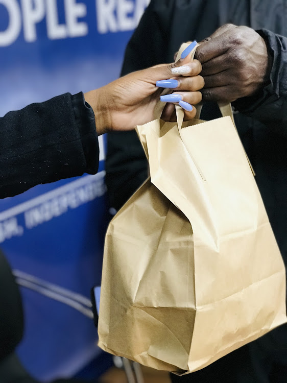 Client receiving her meal order from a bolt food rider