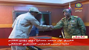 Sudan's General Abdelfattah Mohamed Hamdan Dagalo is sworn in as deputy head of Sudan's Transitional Military Council, standing before the head of the council, Lieutenant General Abdel Fattah Al-Burhan Abdelrahman (R) in Khartoum.