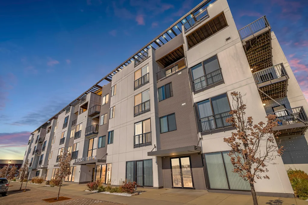 River Rock's apartment building exterior at dusk