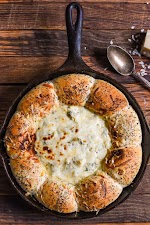 Skilllet Bread and Spinach Artichoke Dip was pinched from <a href="http://neighborfoodblog.com/2016/12/skillet-bread-and-spinach-artichoke-dip.html" target="_blank">neighborfoodblog.com.</a>