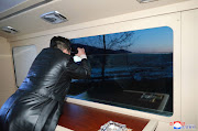 North Korean leader Kim Jong Un observes what state media report is a hypersonic missile test at an undisclosed location in North Korea, January 11, 2022, in this photo released January 12, 2022 by North Korea's Korean Central News Agency (KCNA).