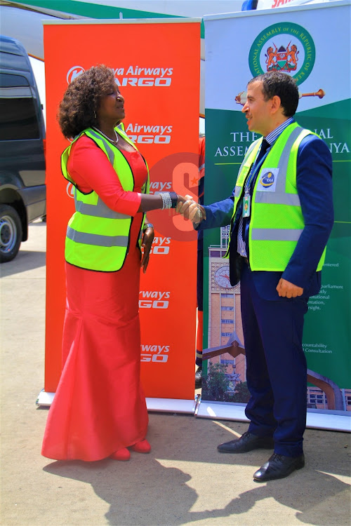 Ag. Algerian Ambassador Hamza Karour shakes hands with National Assembly Deputy Speaker Gladys Shollei after handing over the two vehicles on May 18,2023.