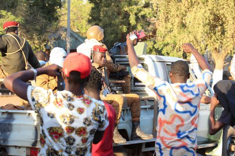 People show their support for the military after they deposed President Kabore in Ouagadougou, Burkina Faso, January 24, 2022.