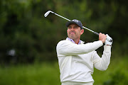 Charl Schwartzel of SA tees off on the 14th hole during day one of the LIV Golf Invitational at The Centurion Club on June 9 2022 in St Albans, England. 