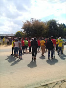 Coligny residents protesting outside the Magistrate's  Court as two farmers apply for bail on Friday.